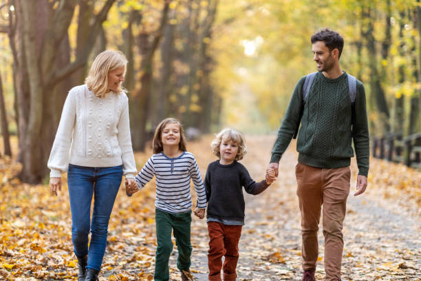 istock Young family having fun outdoors 1182889408