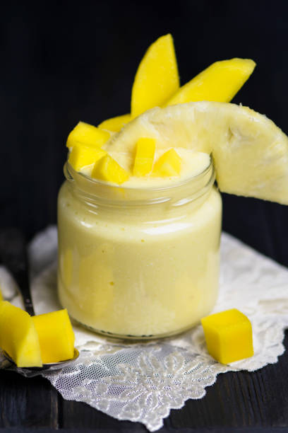 istock smoothie with cottage cheese, pineapple and mango in a glass jar 1182890734