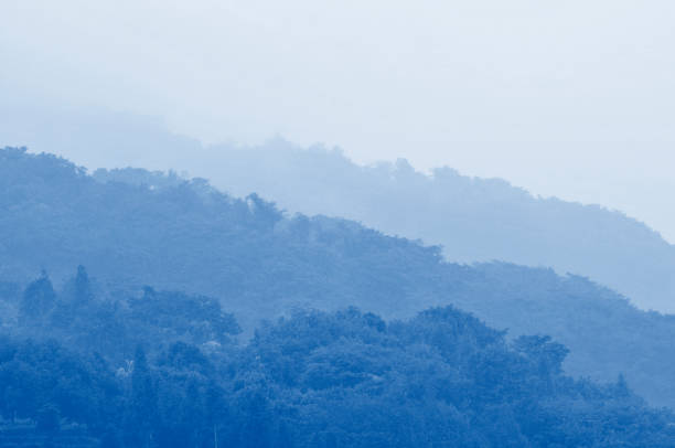 istock Gray clouds over mountain forest in autumn 1182893390