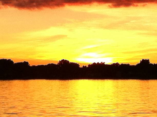 istock Bright Sunset on Lake Lansing in Haslett, Mi 1182894880