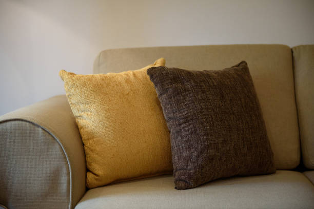 Velvet pillows with traditional Asian ornaments are sold in a street shop. Handmade
