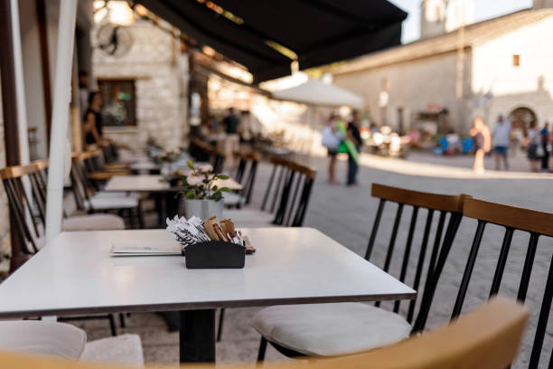 istock Chairs with tables in traditional Greek tavern 1182901523