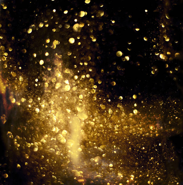 istock golden glitter bokeh lighting texture Blurred abstract background for birthday, anniversary, wedding, new year eve or Christmas 1182901705