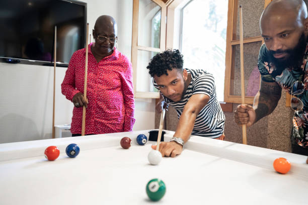 istock Family playing snooker together 1182902680