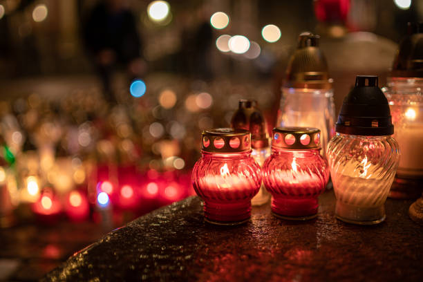istock Jars with burning candles on stone surface at night 1182902808