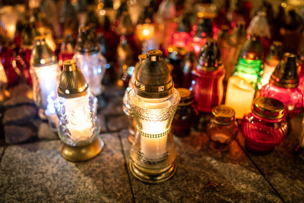 istock Jars with burning candles on stone surface at night 1182902837