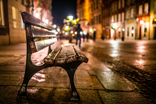 Image of Evening street with benches and lanterns. Night European city
