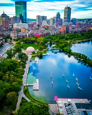 Aerial picture of the boats in the Charles River with Boston’s elegant skyline in the background. The back bay lies quietly next to it