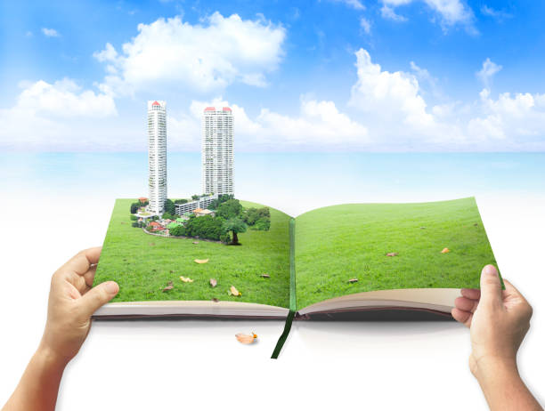 World environment day concept Human hand open book of nature and city on the beach background copyright free medical stock pictures, royalty-free photos & images