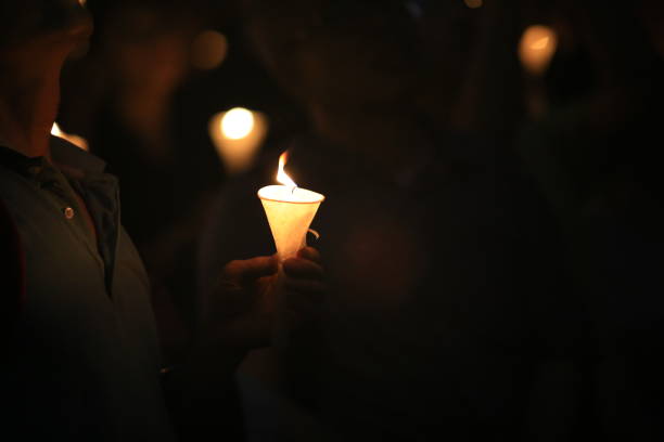 istock vigil of the candlelight demonstration, light in darkness 1182907742