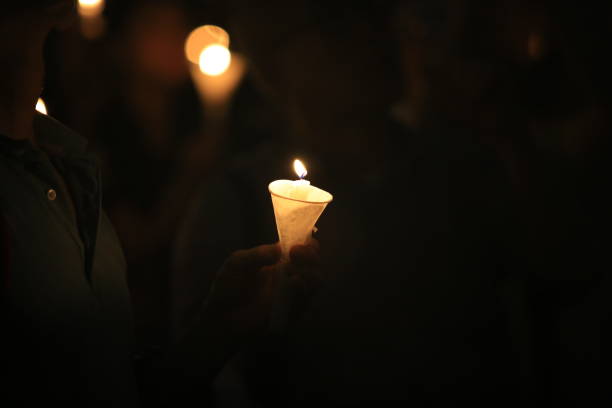 istock vigil of the candlelight demonstration, light in darkness 1182907792