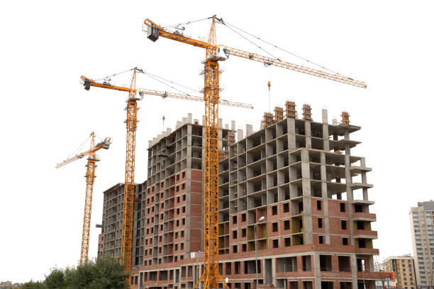 istock Construction site, building a new house, cranes, white sky background 1182908452