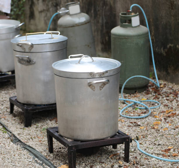 istock outdoor kitchen with many big cauldrons without people 1182908549