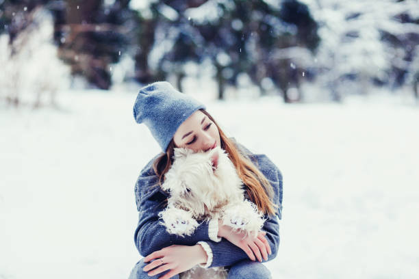 istock woman hugging her dog 1182911662