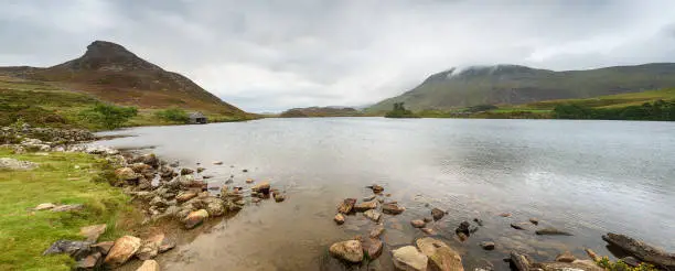 Moody skies over Cregennan Lakes on the slopes of Cadair Idris in Snowdonia National park in Wales
