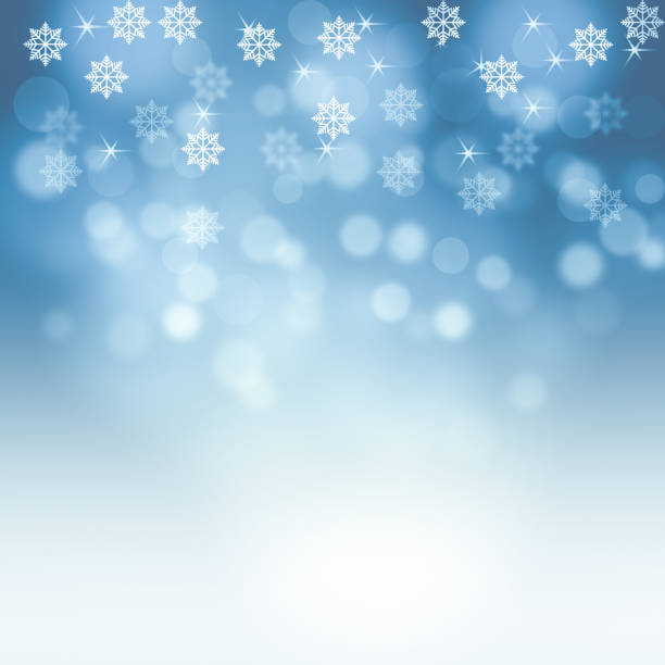 istock Snowflakes and snowfall on a cold blue winter background christmas 1182913479