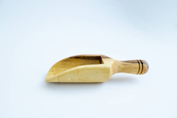 istock Wooden scoop or spoon isolated on a white background 1182914081