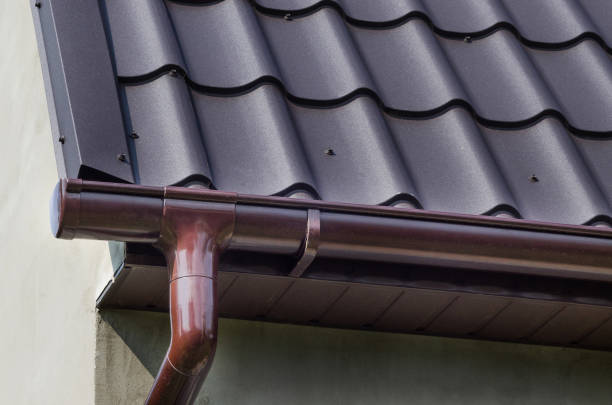istock Corner of the house with gutter. Plastic gutter 1182914227