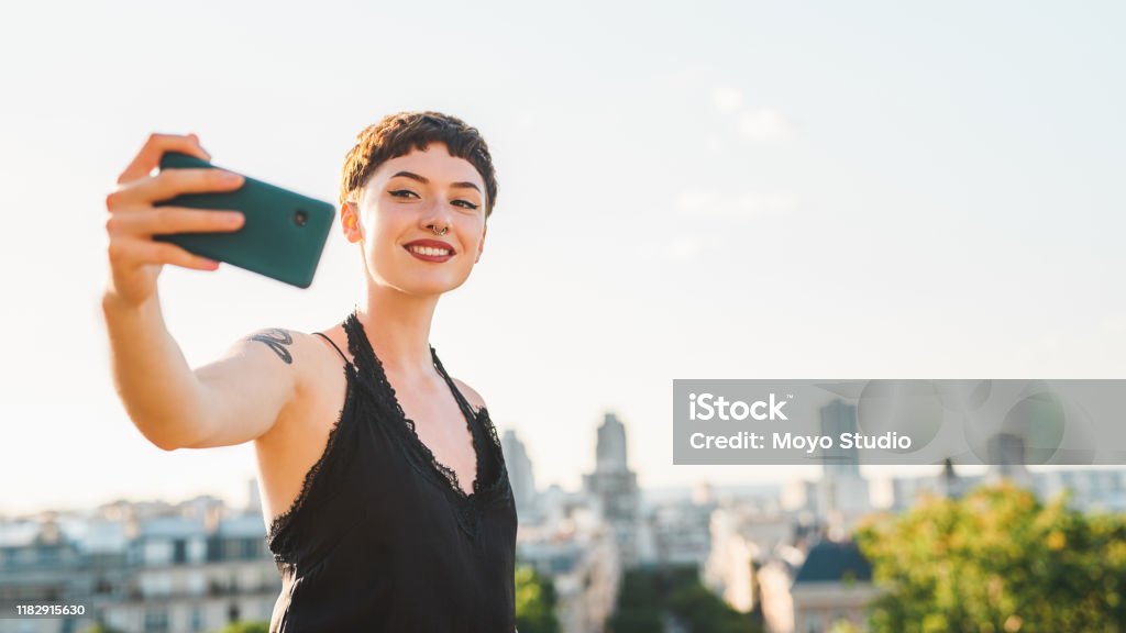 Yep, this is me in Paris! Cropped shot of an attractive young woman taking a selfie while sightseeing in a foreign city during the day Lifestyles Stock Photo