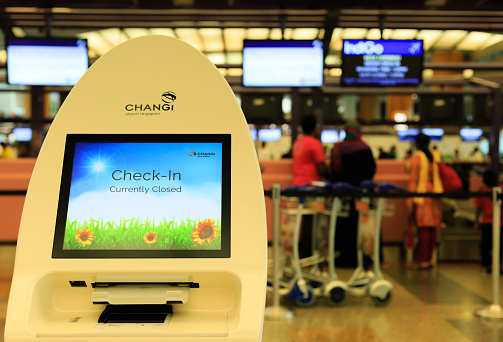 Singapore-28 APR 2018: self check-in kiosk machine in Changi Airport. Changi Airport serves more than 100 airlines operating 6,100 weekly flights