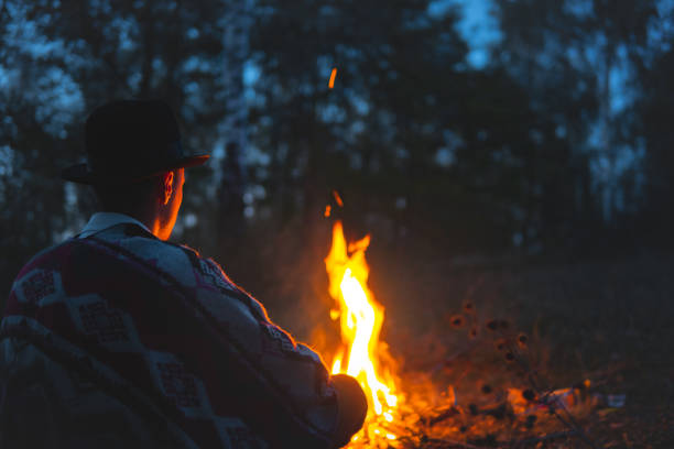 istock Quiet time in the night by the campfire. 1182916425