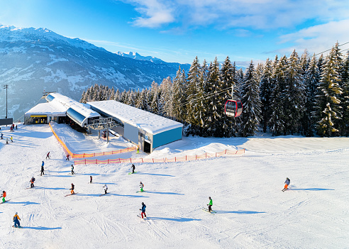 Zillertal Arena ski resort and people skiing Mayrhofen in Austria