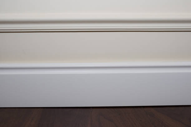 istock White wall, plinth and tile, parquet floor. 1182917132
