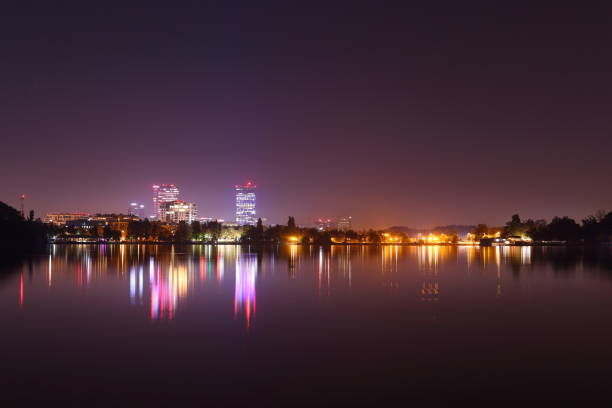 istock Night picture of skyline reflected in lake 1182917457