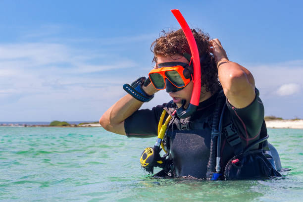istock Close up young dutch diver stands in sea 1182917500