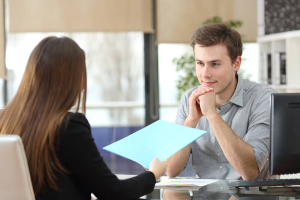 istock Businesspeople talking and sharing report at office 1182919058
