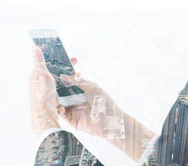 istock Multiple exposure of businesswoman hands using mobile phone 1182919430