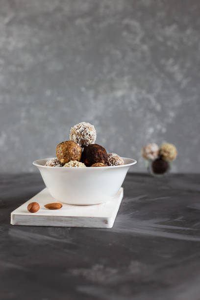 istock Energy protein balls on a gray table. Healthy, nutritious snack. Vertical photo. 1182921648