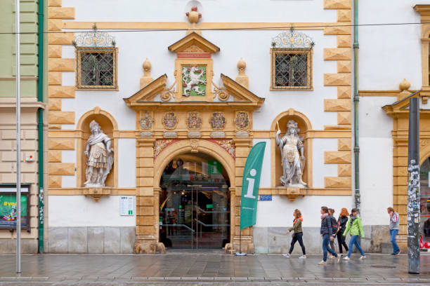 Graz, Austria - May 28 2019: Entrance of the Styrian Armoury (German: Landeszeughaus), the world's largest historic armoury holding approximately 32,000 pieces of weaponry, tools, suits of armour for battle and ones for parades.
