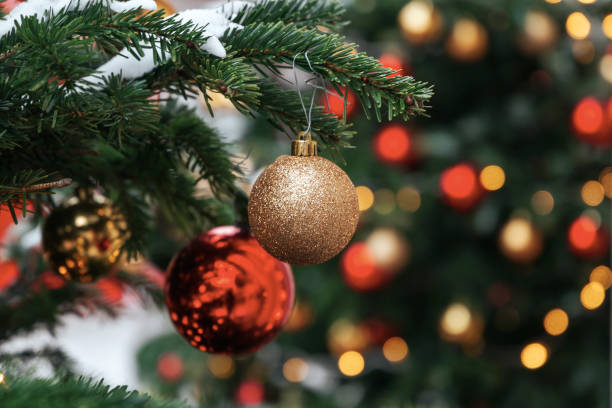 istock Christmas tree background and Christmas decorations with snow, blurred, sparking, glowing. 1182925482