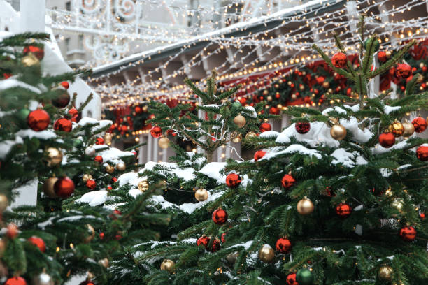 istock Christmas tree background and Christmas decorations with snow, blurred, sparking, glowing. 1182925508