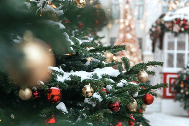 istock Christmas tree background and Christmas decorations with snow, blurred, sparking, glowing. 1182925523