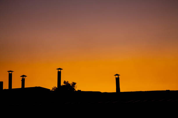 The roof pipes at sunset background