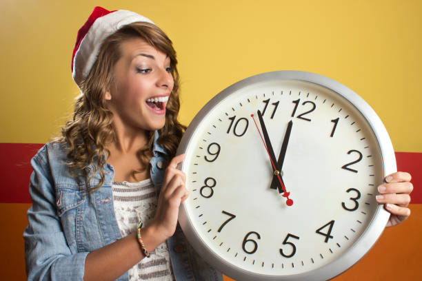 istock Woman with Santa cap at midnight 1182925892