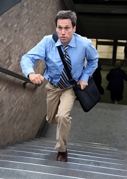 istock Businessman Runs Up Staircase 118292659