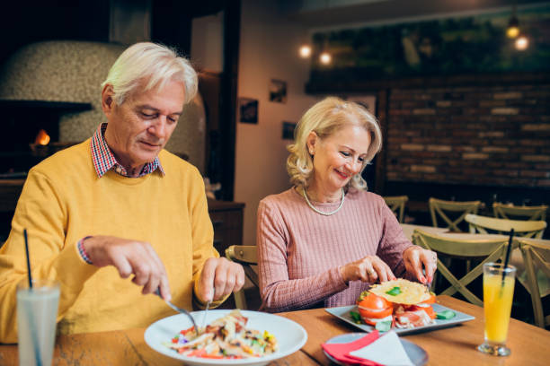 istock Mature couple eating at the restaurant 1182926905