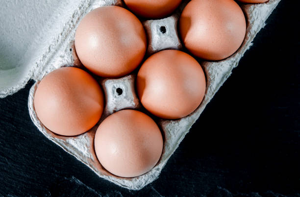 istock Large brown chicken eggs lie in an eco-friendly cardboard egg tray 1182927199