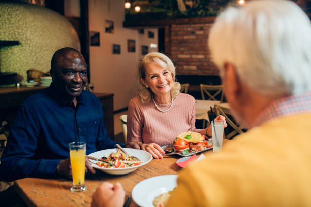 istock Seniors enjoying their  gathering at the restaurant 1182928421