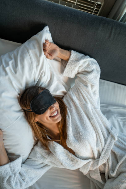 istock Beautiful young woman waking up 1182930475