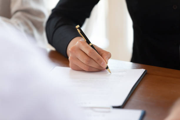 istock Male customer sign business document on table, close up view 1182933809