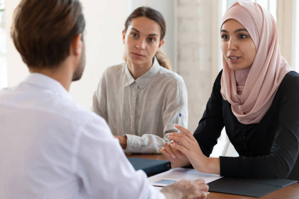 istock Asian muslim female hr manager interviewing applicant consulting client 1182933813