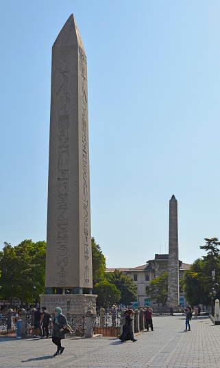 Istanbul, Turkey - September 5th 2019. The Obelisk of Theodosius in the Hippodrome in Sultanahmet, Istanbul, Turkey. The Walled Obelisk can be seen in the background, also known as the Constantine Obelisk or the Masonry Obelisk