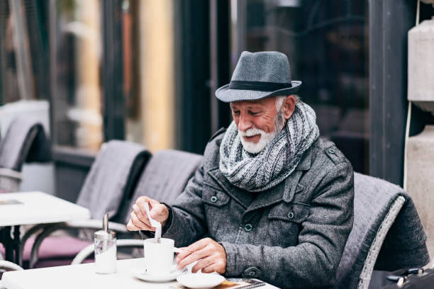 istock Senior Man Drinking Tea in the City Cafe 1182934187