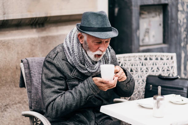 istock Senior Man Drinking Tea in the City Cafe 1182934251