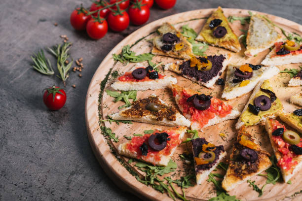 istock Canapes on wooden plate 1182934677