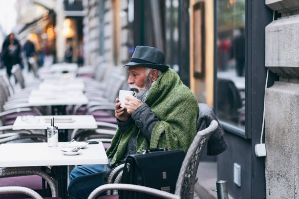 istock Senior Man Drinking Tea in the City Cafe 1182934892
